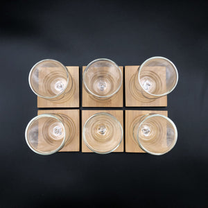 A Set Of 6 Bamboo Coaters/ Trays With 6 Doublewalled Thermo Glasses To Match